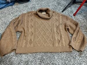 Ellie Tahari cable knit sweater features a chunky cowl neck design